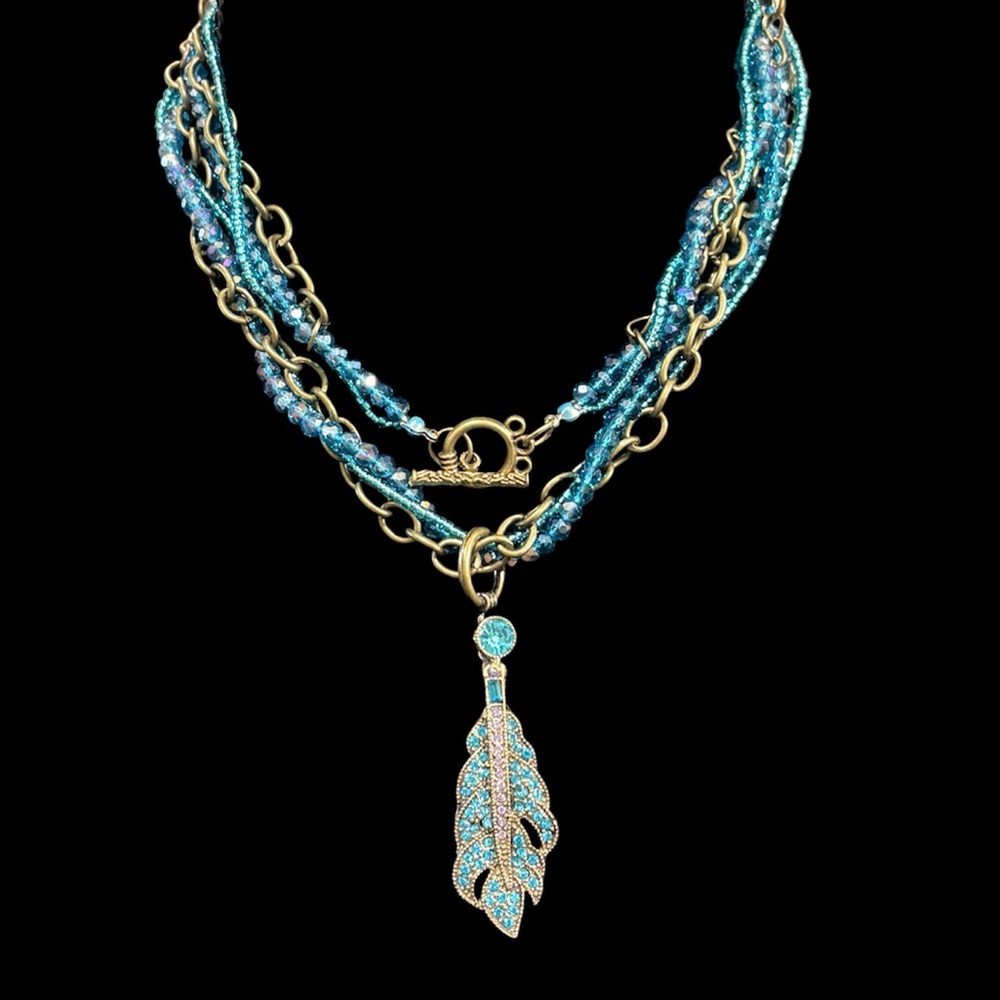 Heidi Daus Gold and Blue Feather Crystal Pendant.